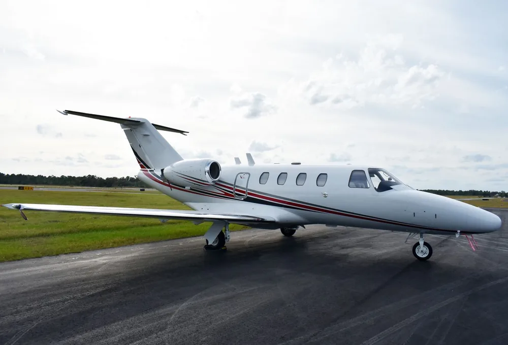 White business aircraft on an airport apron