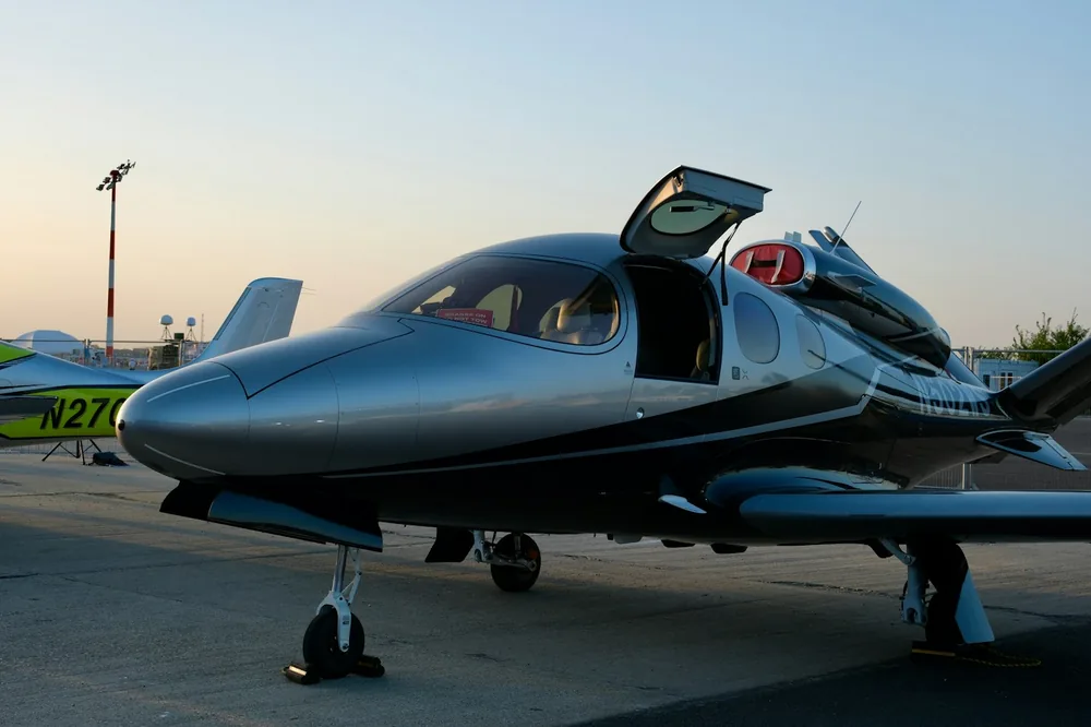Small private aircraft parked in evening light